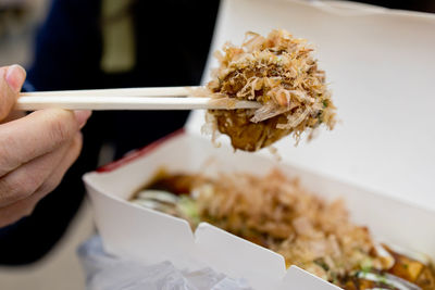 Close-up of hand holding food