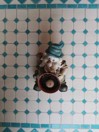 High angle view portrait of woman on floor at home