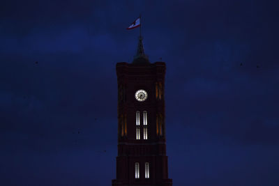 Berlin red clock tower at night