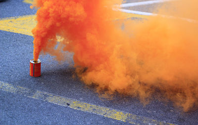 Orange smoke that exits from a cans