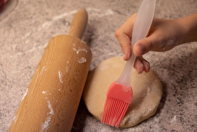 Midsection of person preparing food on wood