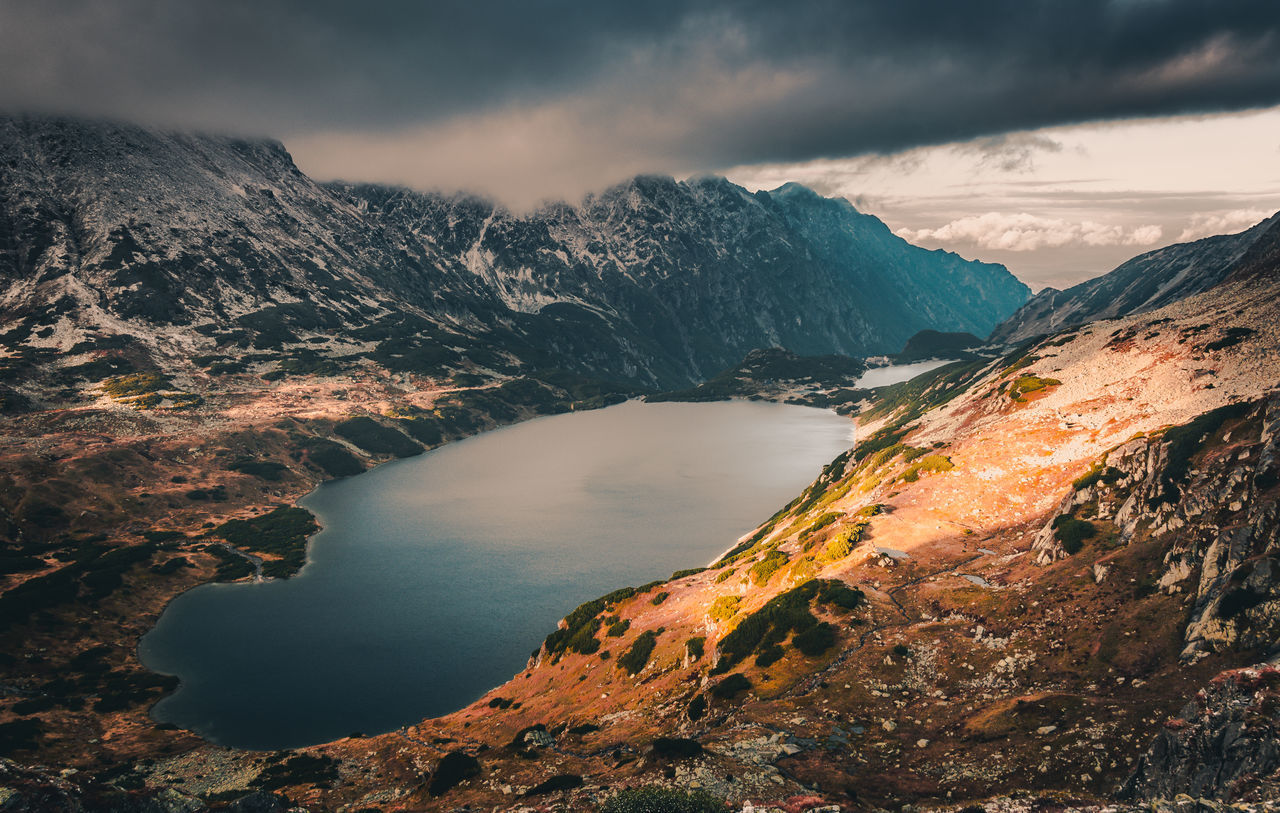 mountain, cloud - sky, scenics - nature, beauty in nature, sky, water, tranquil scene, tranquility, mountain range, no people, nature, idyllic, non-urban scene, environment, landscape, lake, geology, remote, outdoors, snowcapped mountain