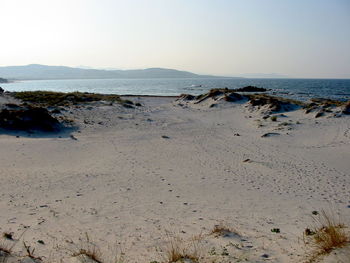 Scenic view of beach against clear sky