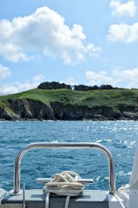 Boat sailing in sea against sky