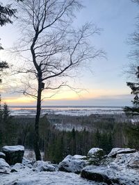Scenic view of frozen lake against sky during winter