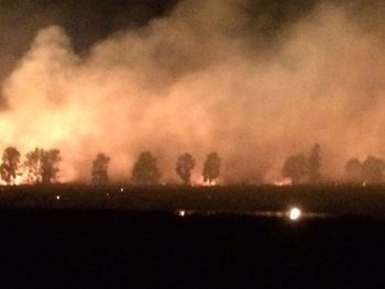 Scenic view of landscape against sky at sunset