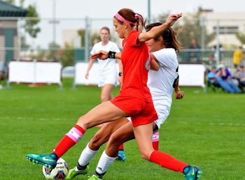 People playing soccer on field