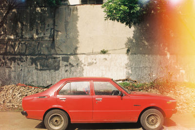 Red vintage car in city