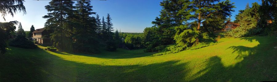 Panoramic view of golf course against sky