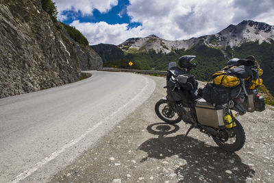 Adventure motorcycle parked beside a road in tierra del fuego