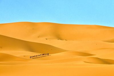 Scenic view of desert against clear sky