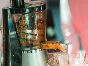 Close-up of drink in glass jar on table