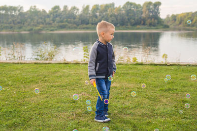 Boy standing in lake