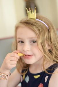 Close-up of young woman eating food