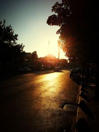 View of city street at sunset