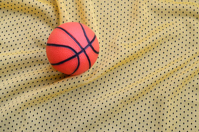 Directly above shot of basketball and textile