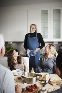 Man serving food to family