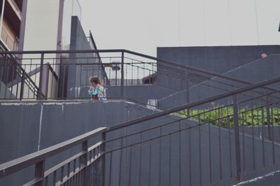 Woman standing in front of building