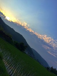 Scenic view of sea against cloudy sky