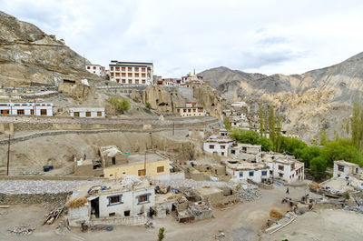 Buildings in city against sky