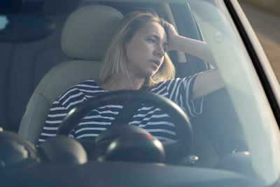 Woman sitting in car