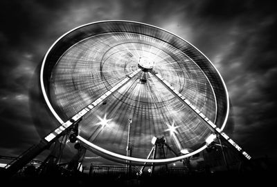 Low angle view of illuminated ferris wheel