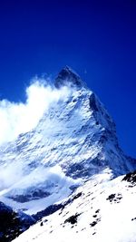 Low angle view of snow covered mountains