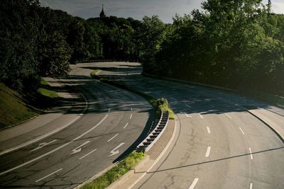 High angle view of empty road amidst trees