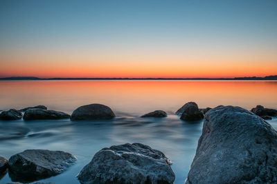 Scenic view of sea against dramatic sky