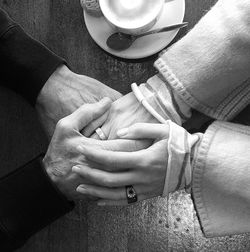 Close-up of couple holding hands