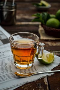 Close-up of lime tea drink on table