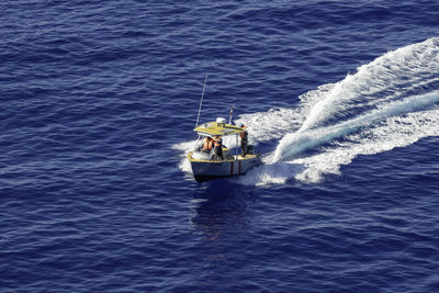 High angle view of people on sea