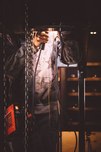 Rear view of a young man standing outdoors