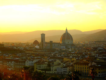 Cityscape against sky during sunset