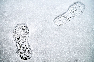 High angle view of footprints in snow