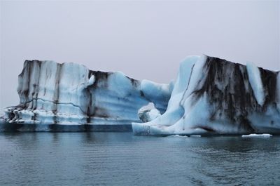 Scenic view of frozen lake against sky