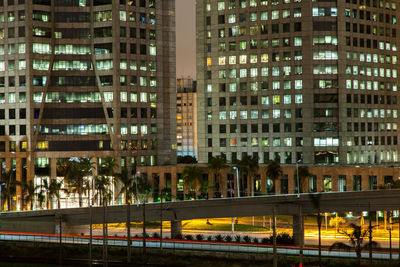 Buildings in city at night