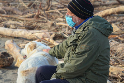 Side view of man with dog