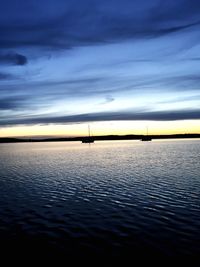 Scenic view of sea against sky at sunset