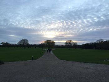 Scenic view of field against sky during sunset