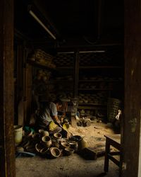 Side view of mature man working in workshop