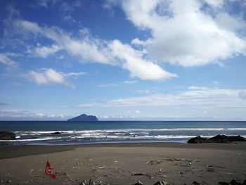 Scenic view of beach against sky