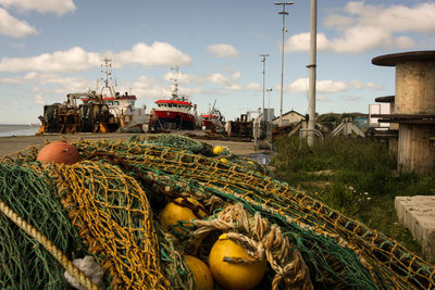 Fishing boat on sea against sky