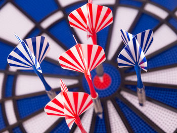 Close-up of darts on dartboard