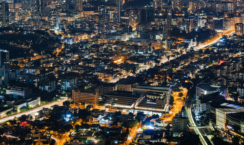 High angle view of illuminated cityscape at night at wong tai sin, hong kong