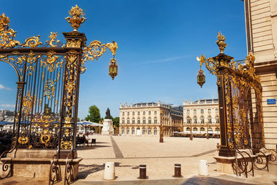 Buildings in city against blue sky