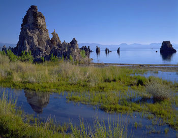 Scenic view of lake against blue sky