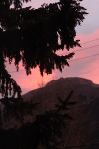 Scenic view of silhouette mountain against sky at sunset