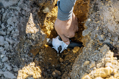 Close-up of hand holding pipe