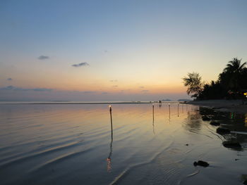 Scenic view of sea against sky at sunset